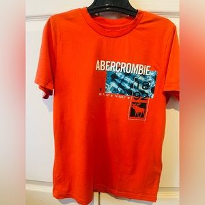 orange shirt size 11/12 in good condition